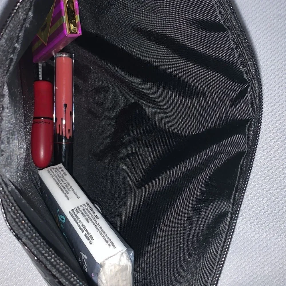 Zipper Black clutch/ wristlet  style purse in faux patent leather.